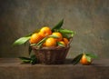 Still life with tangerines in a basket Royalty Free Stock Photo