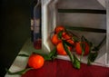 Still life with tangerines, bottles with a drink and a box. Ripe citrus fruits. Royalty Free Stock Photo