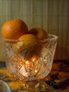 Still life tangerines gifts of nature in a crystal vase Royalty Free Stock Photo