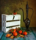 Still life with tangerines, a jug and a box. Ripe citrus fruits. Royalty Free Stock Photo