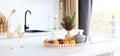 Still life of tangerines, teapot and scales with spruce branch on kitchen table Royalty Free Stock Photo