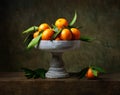 Still life with tangerines in vase for fruits Royalty Free Stock Photo