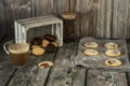 Still life with tea biscuits with jam, cup of coffee and chocolate covered tea pastries Royalty Free Stock Photo