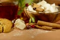 Still life with tea, oriental sweets, cherries and cinnamon