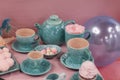 Still life. Tea set in pink and blue with sweets Royalty Free Stock Photo