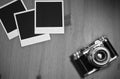 Still life three blank instant photo frames on old wooden background with old retro vintage camera with copy space Royalty Free Stock Photo