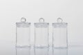 Still life of three glass jars with lids. Royalty Free Stock Photo