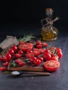 Still life with tomatoes of different sizes, Royalty Free Stock Photo