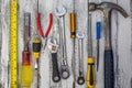 Set of construction tools on the white,rustic wooden background Royalty Free Stock Photo