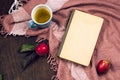 Still life with top view apple, tea and vintage book