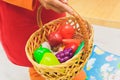 Still life from toy artificial plastic vegetables and fruits in blue basket. Grapes, orange, cabbage, apple, pepper Royalty Free Stock Photo