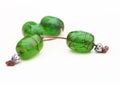 Still life of traditional greek rosary with green fossilized amber gemstone