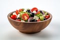 Still life traditional Greek salad presented beautifully in rustic wooden bowl. Salad boasts vibrant colors with crisp c Royalty Free Stock Photo