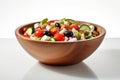 Still life traditional Greek salad presented beautifully in rustic wooden bowl. Salad boasts vibrant colors with crisp cucumbers Royalty Free Stock Photo