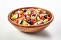 Still life traditional Greek salad presented beautifully in rustic wooden bowl. Royalty Free Stock Photo