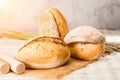 Still life with a traditional round artisan wheat bread loaves o