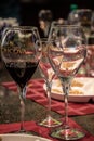 Abstract wineglasses still life on table with red napkins