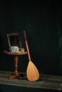 Still life in turkish Muslim ottoman oriental style. Turkish national musical instrument baglama saz, jewelry box and mirror on