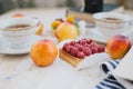 Still life with two cups of tea in a vintage cups and two tarts with fresh fruits on a white vintage background Royalty Free Stock Photo