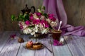 Two cakes, a bouquet of flowers and a cup of coffee Royalty Free Stock Photo