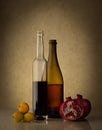 Still life with two wine bottles and fruits Royalty Free Stock Photo