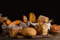 Still life of a variety of bread on a black background, bakery banner