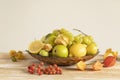 Still life:various assorted fruits (grape, apple,pear,lemon,lime,rowan, physalis) in copper plate Royalty Free Stock Photo