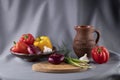 Still life with vegetables on a gray drapery background. Royalty Free Stock Photo