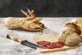 Still life with village bread on a wooden board along Royalty Free Stock Photo