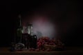 Still Life ,Vine of grape with wine on wooden table Royalty Free Stock Photo