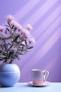 Still life in violet, lilac color. A cup of coffee and a vase of flowers on the table Royalty Free Stock Photo