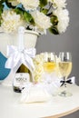 Still life with wedding rings, flowers, champagne Royalty Free Stock Photo