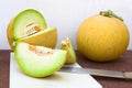 Still life of a pair of yellow melons cantaloupes, one of them open Royalty Free Stock Photo