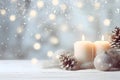 Still life with white Christmas candles, pine cones and silver balls. Royalty Free Stock Photo