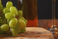 Still life with white juicy grapes, bottle of white wine without any label Royalty Free Stock Photo