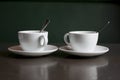 Still life, white kettle and cups on the table Royalty Free Stock Photo