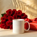 Still life of a white mug with red roses and a red gift box on a table with a shadow background Royalty Free Stock Photo