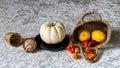 still life on a white tablecloth, fruit in a wicker basket and other objects Royalty Free Stock Photo
