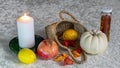 still life on a white tablecloth, fruit in a wicker basket and other objects Royalty Free Stock Photo