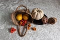 still life on a white tablecloth, fruit in a wicker basket and other objects Royalty Free Stock Photo