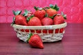 Still life wicker basket with a bunch of strawberries Royalty Free Stock Photo