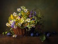 Still life with wild flowers in basket Royalty Free Stock Photo