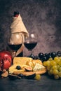 still life wine different cheeses and fruits Royalty Free Stock Photo