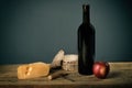 Still life with wine and fruit cheese, corkscrew. Royalty Free Stock Photo