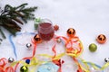 Still life wine, gifts and Christmas tree ornaments in the snow. Royalty Free Stock Photo