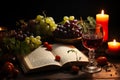 Still life with wine, grape, open Holy bible and candles on wooden table Royalty Free Stock Photo