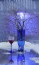 Still life. A winter bouquet. The blue vase. A glass of wine. Snow. Cold. Royalty Free Stock Photo