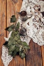 Still life with a small metal coffee pot, a metal sugar cup and ivy on an old wooden table Royalty Free Stock Photo