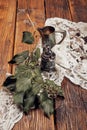 Still life with a small metal coffee pot, a metal sugar cup, coffee beans and ivy on an old wooden table Royalty Free Stock Photo