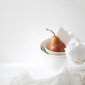 Still life with yellow-red pear Duchess in pile of bowls Royalty Free Stock Photo